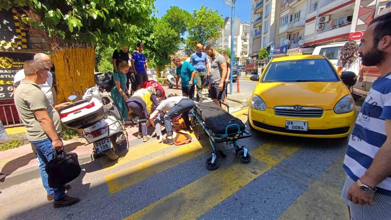Efeler’de yolun karşısına geçmek isteyen kadına taksi çarptı: 1 yaralı
