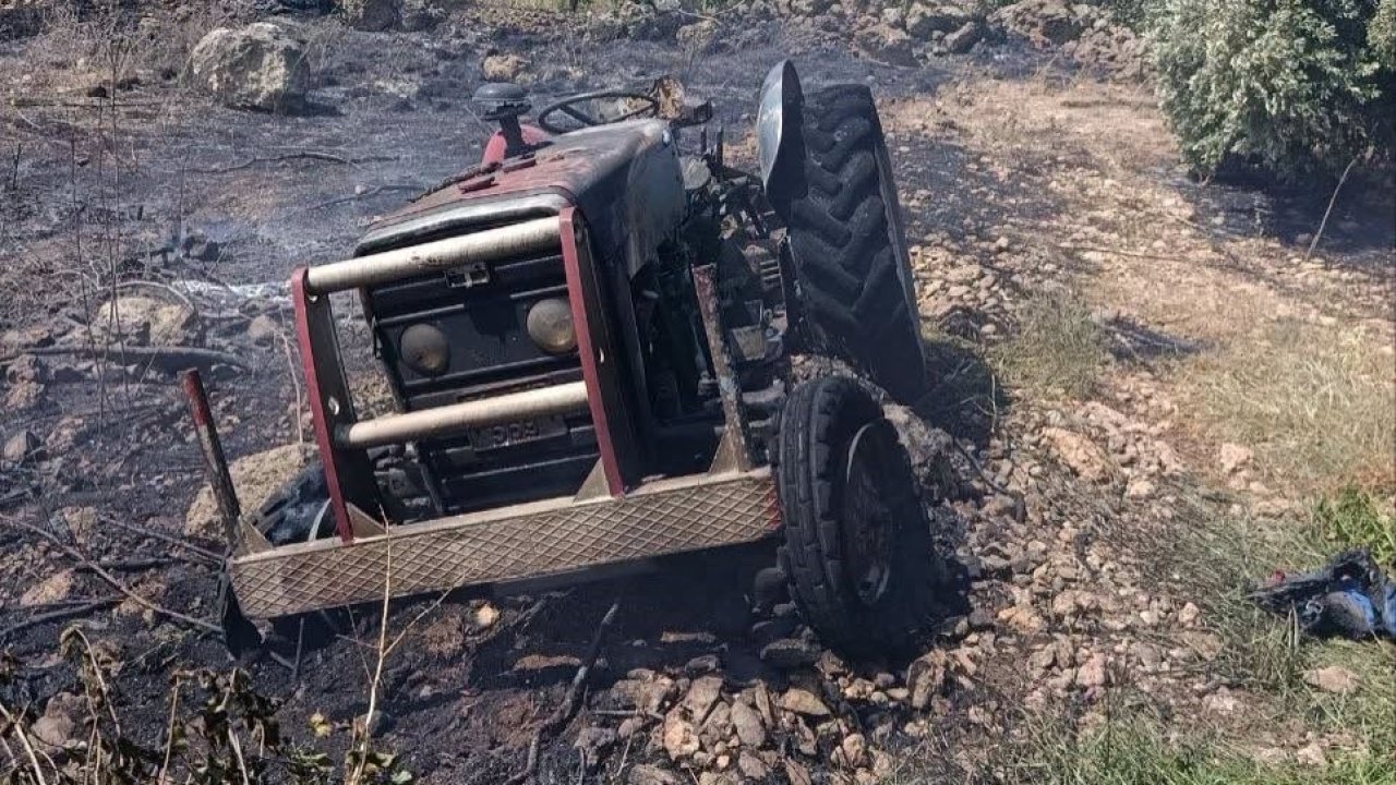Erzin’de otluk alanda çıkan yangında alevler traktöre sıçradı