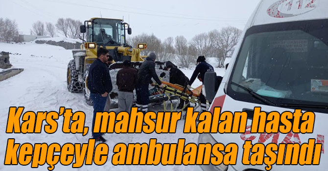 Kars’ta, mahsur kalan hasta kepçeyle ambulansa taşındı