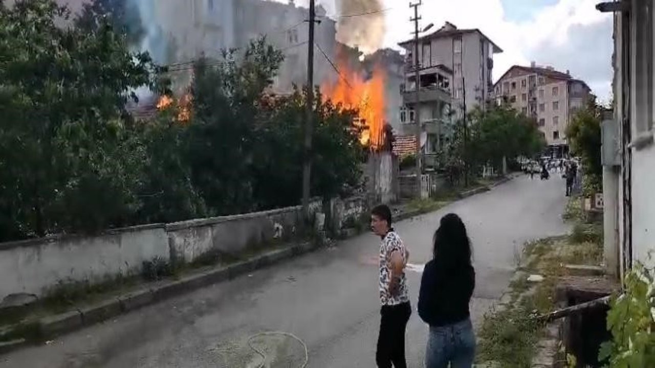 Metruk binada çıkan yangına mahalleli hortumla müdahale etti