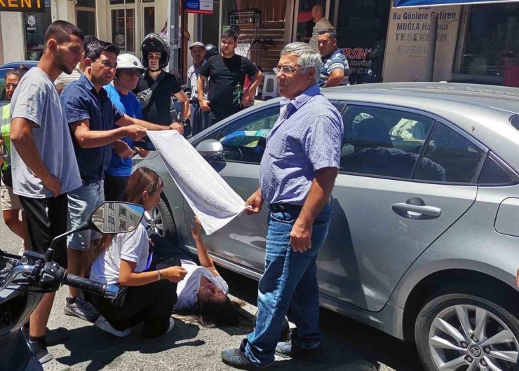 Vatandaşlar yaralı kadın sürücüyü güneşten havluyla korudu